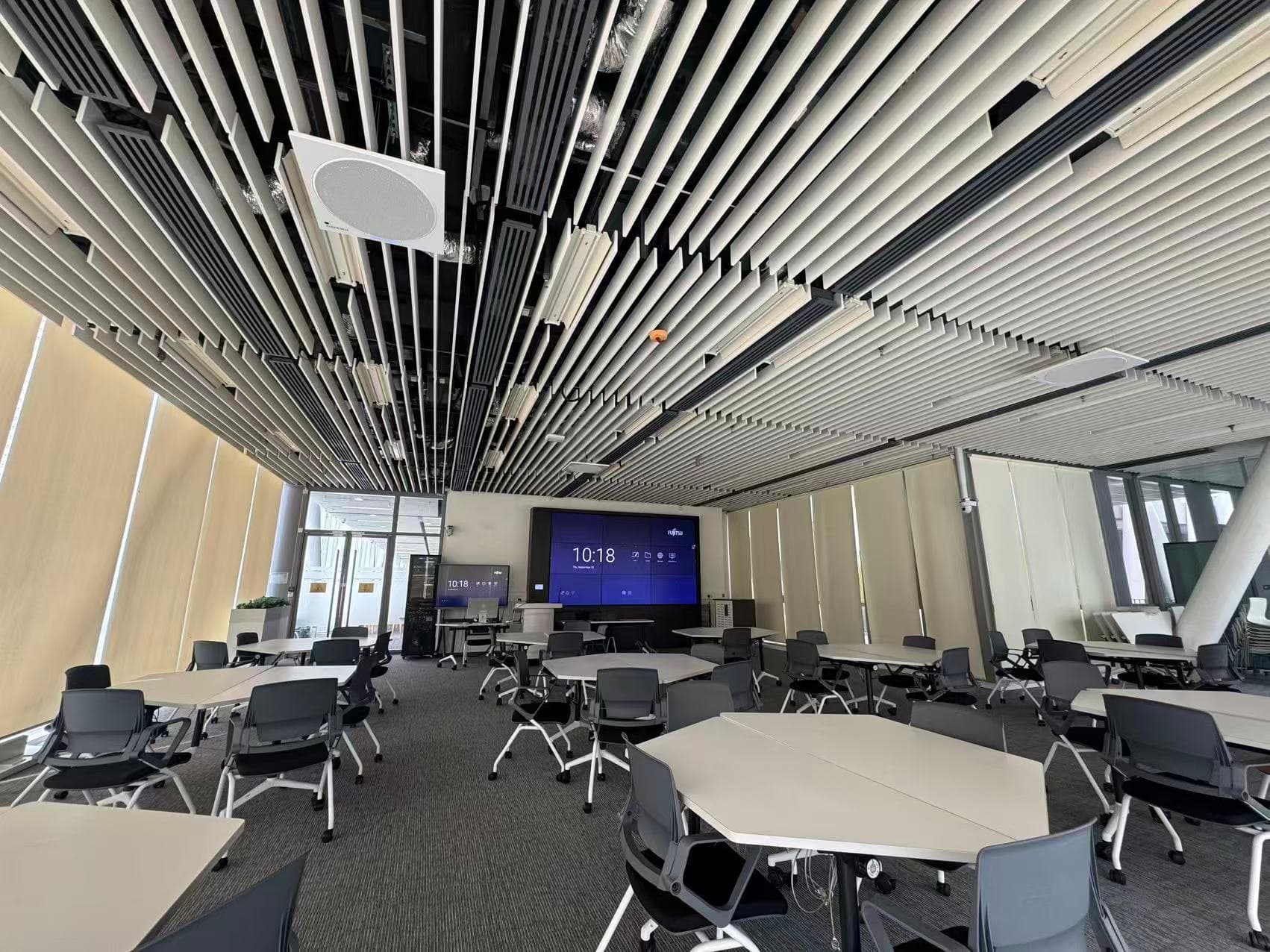 The classroom with ceiling microphones installed for local voice reinforcement.
