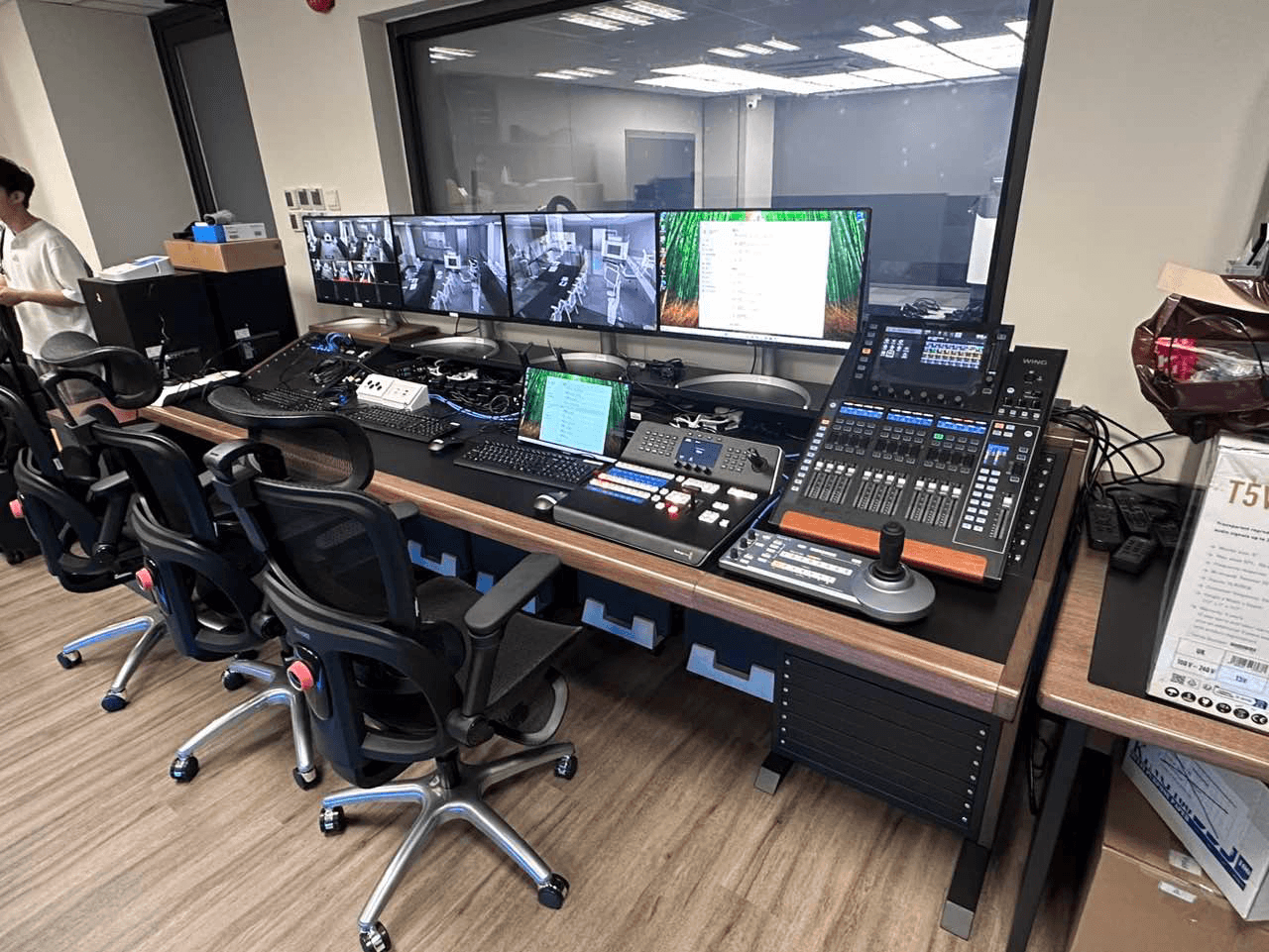 Recording control position with monitoring displays and audio mixing equipment.